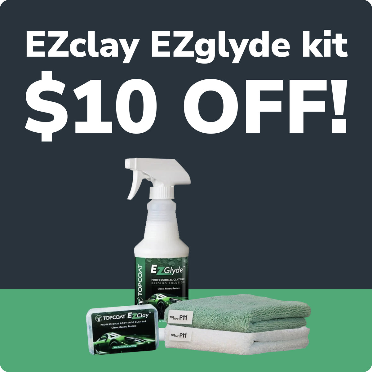 Promotional graphic for the EZclay EZglyde kit showing a white spray bottle, a small box, and two folded microfiber towels on a green and dark gray background with large text reading 'EZclay EZglyde kit $10 OFF!'.